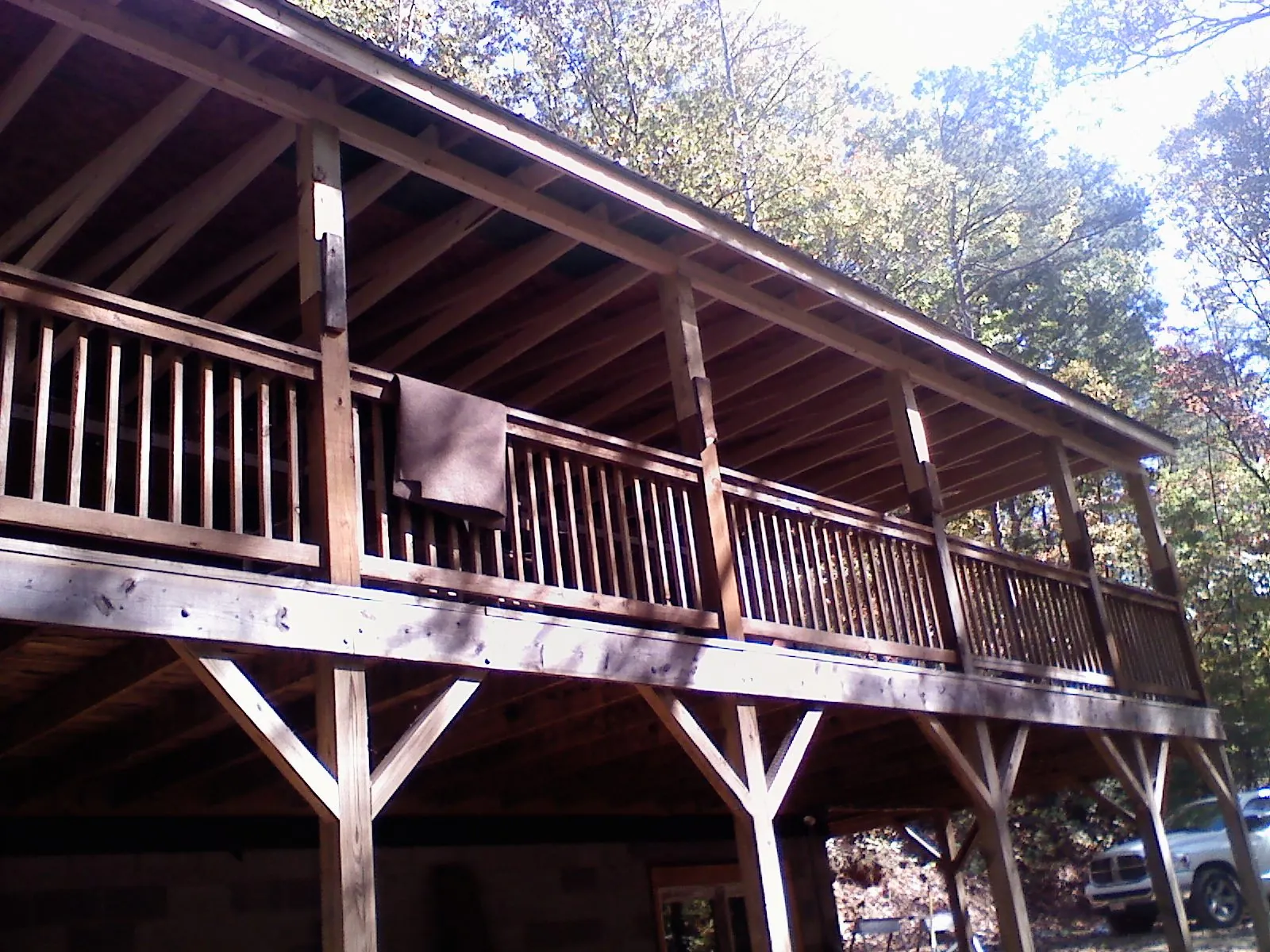 Timber framing under a new elevated porch and deck — Roof Leak Repair in Morris by Roofing Brothers